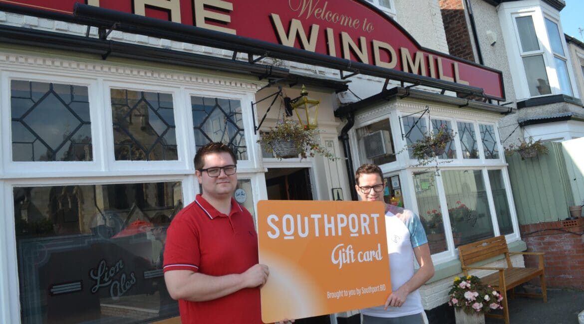 Neil Walsh and partner Tom Hodgin at The Windmill pub on Seabank Road in Southport with the Southport Gift card